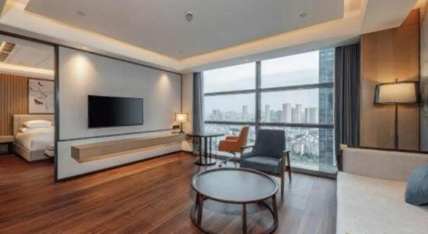 Bed in New Century Grand Hotel Ningbo Zhongdu