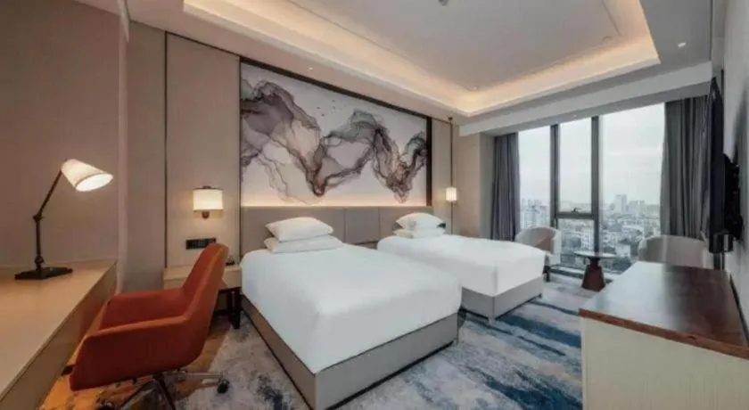 Bed in New Century Grand Hotel Ningbo Zhongdu