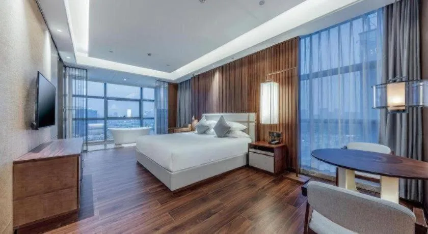 Bed in New Century Grand Hotel Ningbo Zhongdu