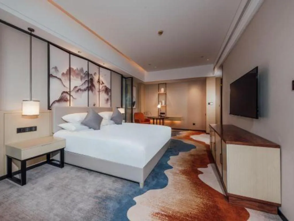 Bed in New Century Grand Hotel Ningbo Zhongdu
