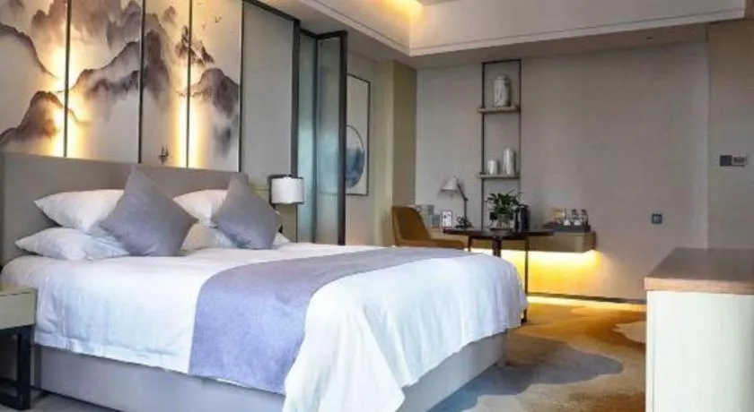 Bed in New Century Grand Hotel Ningbo Zhongdu
