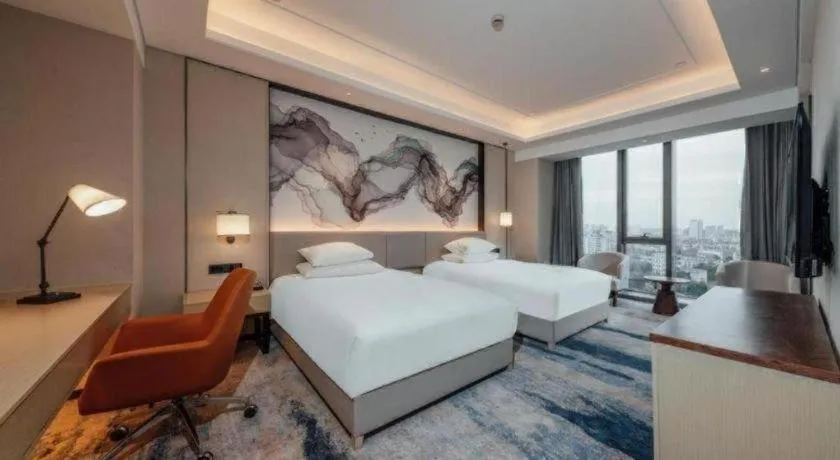 Bed in New Century Grand Hotel Ningbo Zhongdu