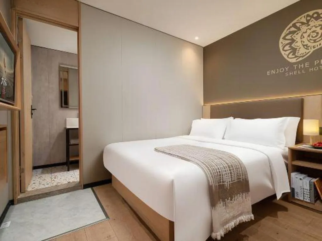 Bed in Shell Hotel Beijing Shunyi District Shunyi Metro Station