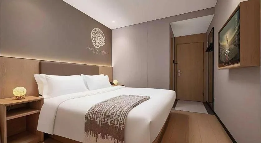 Bed in Shell Hotel Beijing Shunyi District Shunyi Metro Station