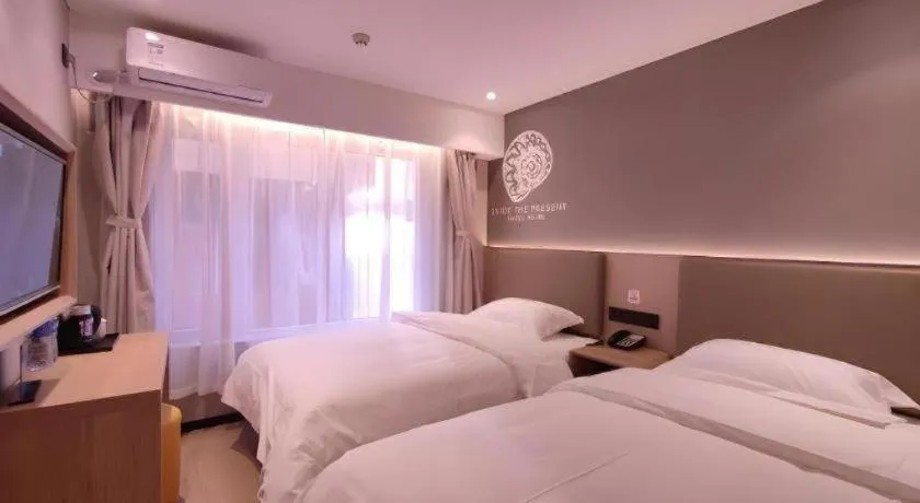 Bed in Shell Hotel Beijing Shunyi District Shunyi Metro Station