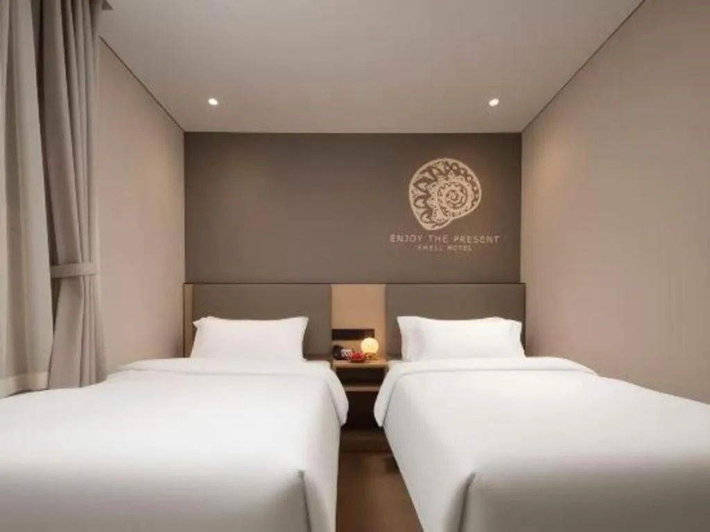 Bed in Shell Hotel Beijing Shunyi District Shunyi Metro Station