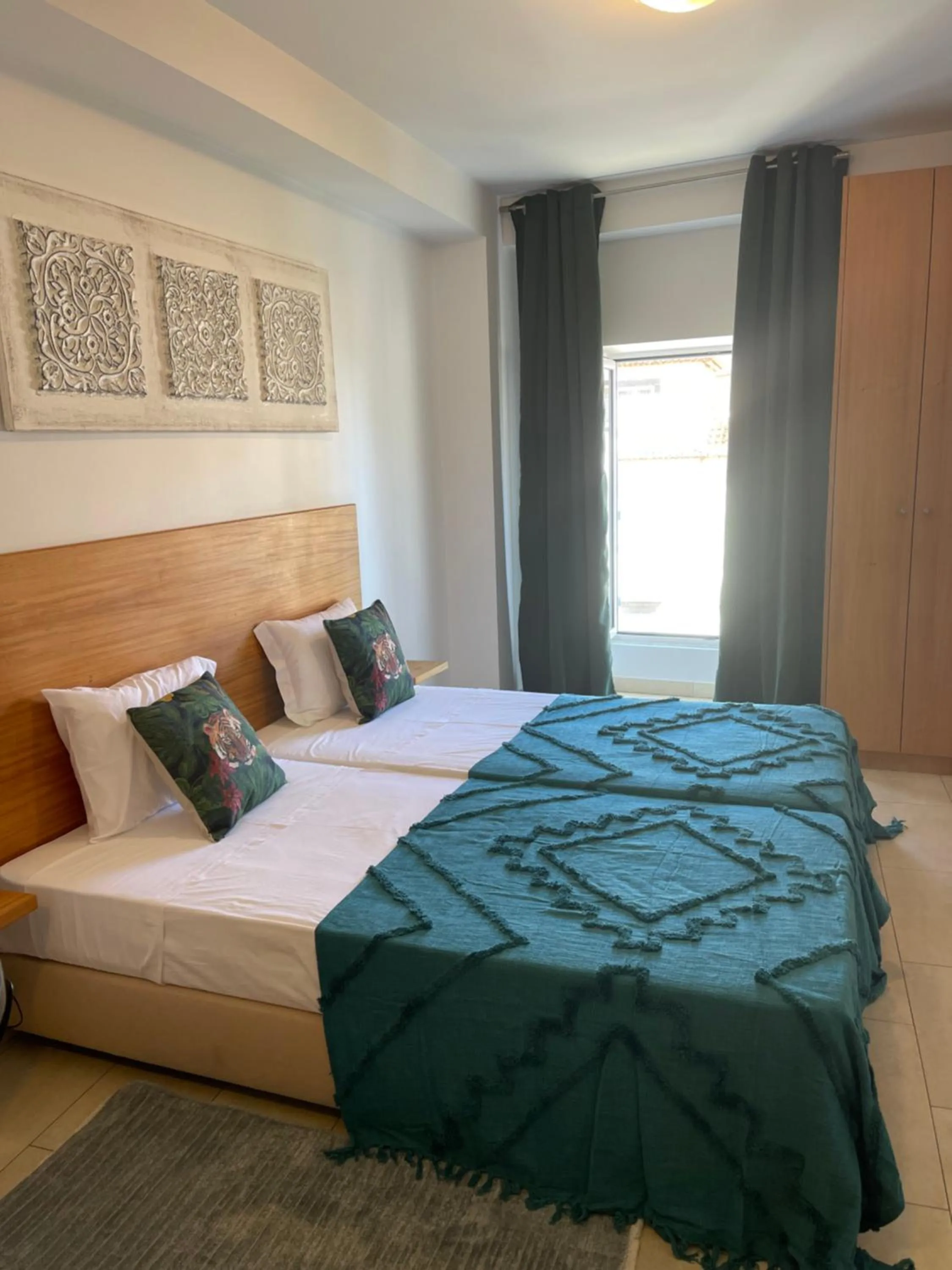 Bed in Esmeralda Holidays Apartments