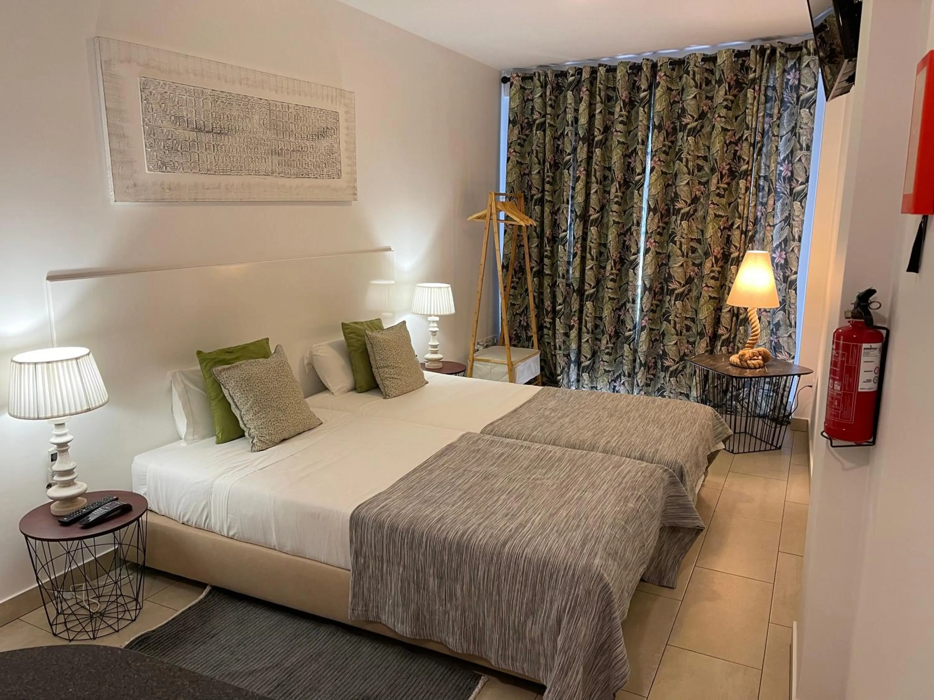 Bed in Esmeralda Holidays Apartments