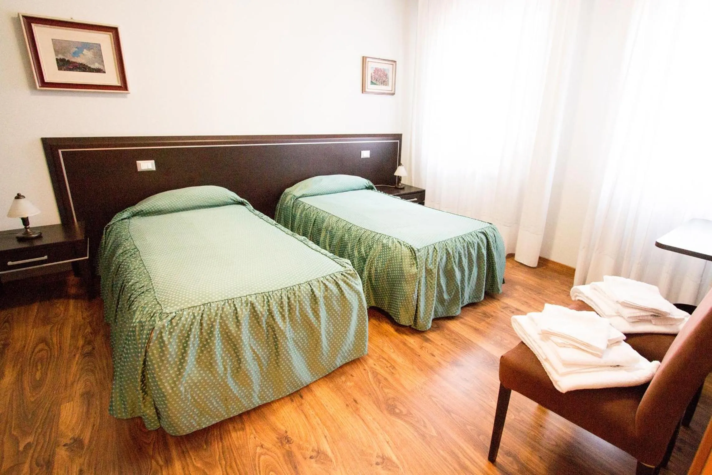 Bed in Al Benvenuto Hotel & Restaurant