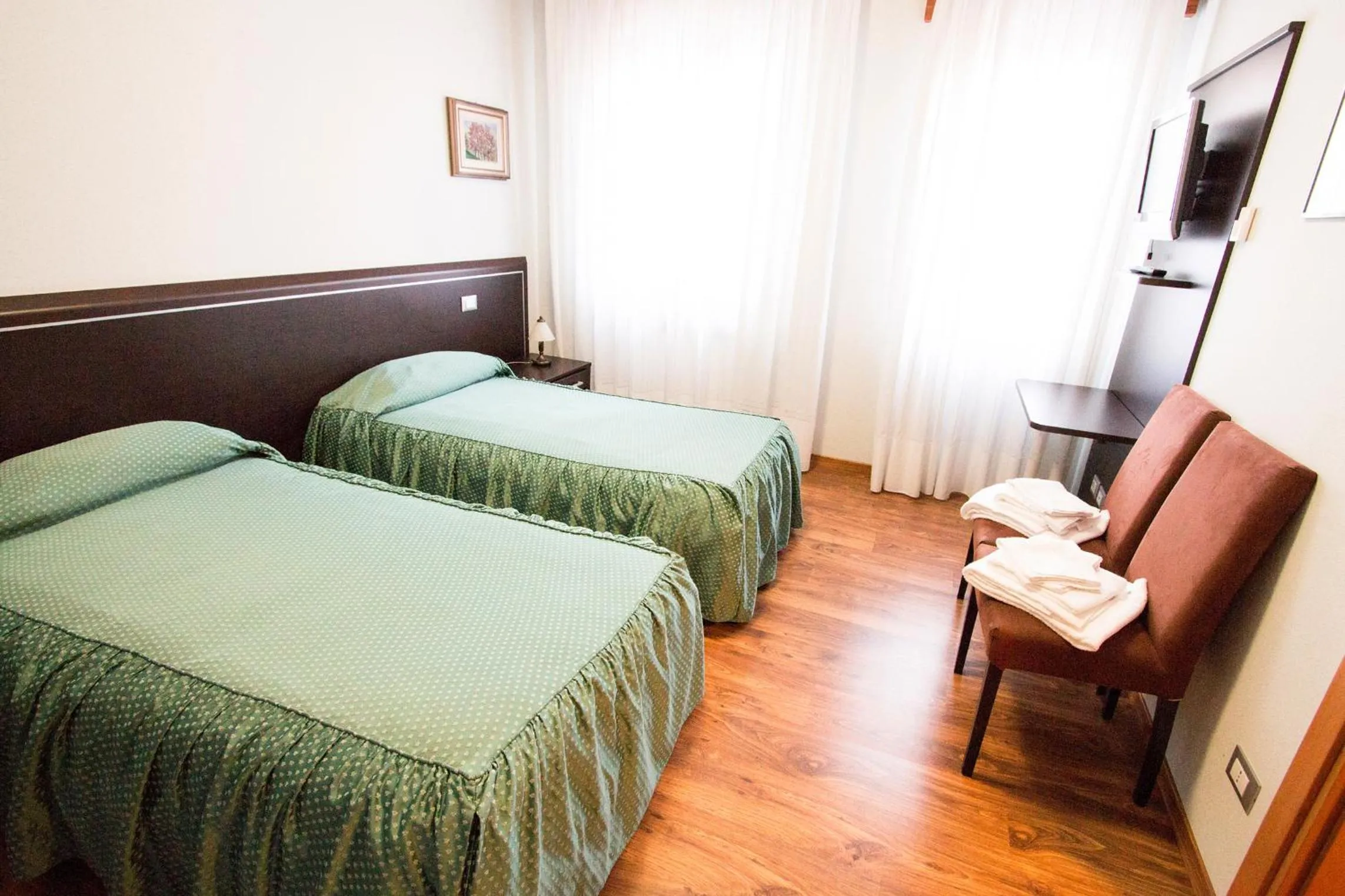 Bed in Al Benvenuto Hotel & Restaurant