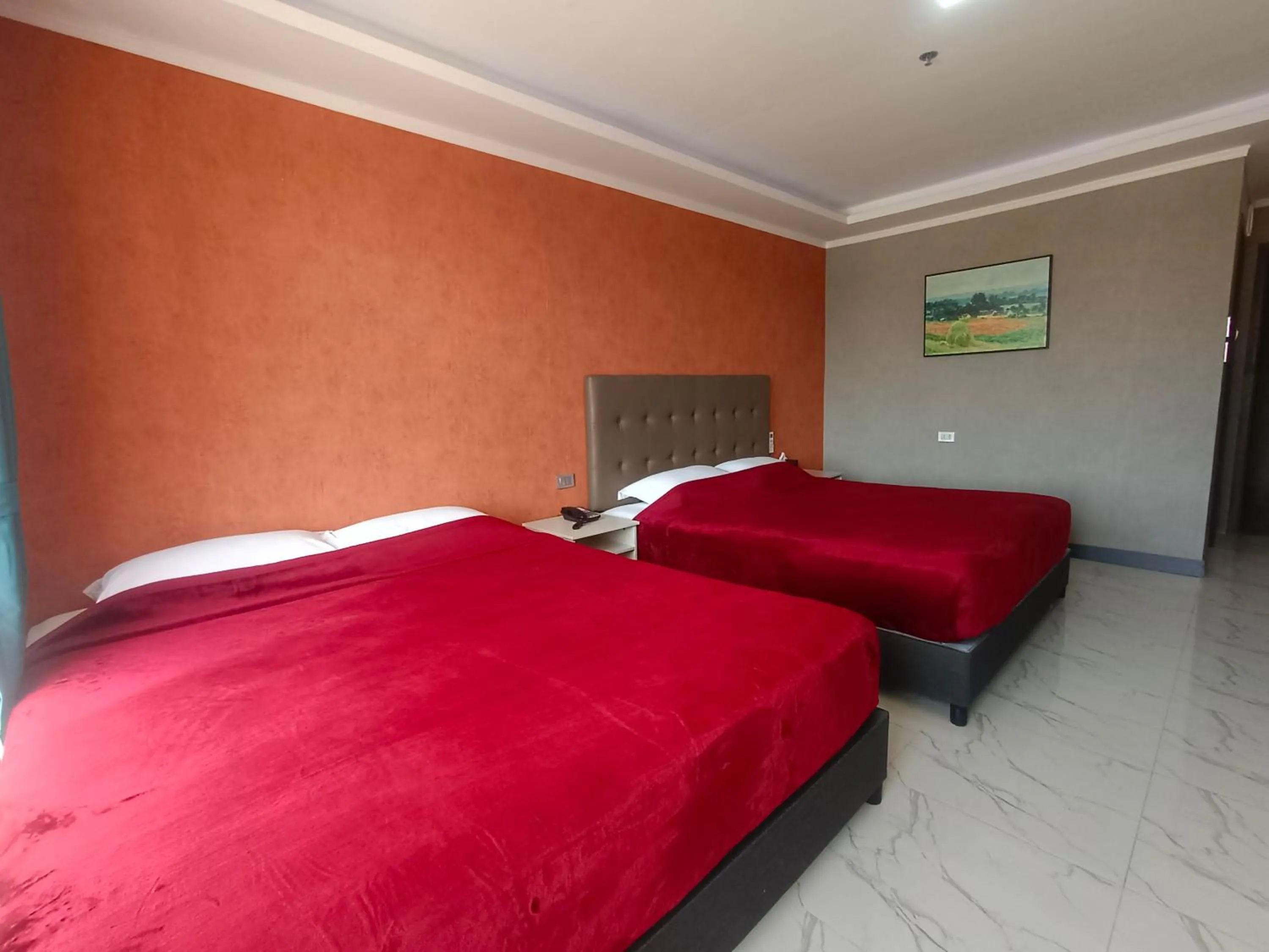 Bed in Blue Hotel and Resort