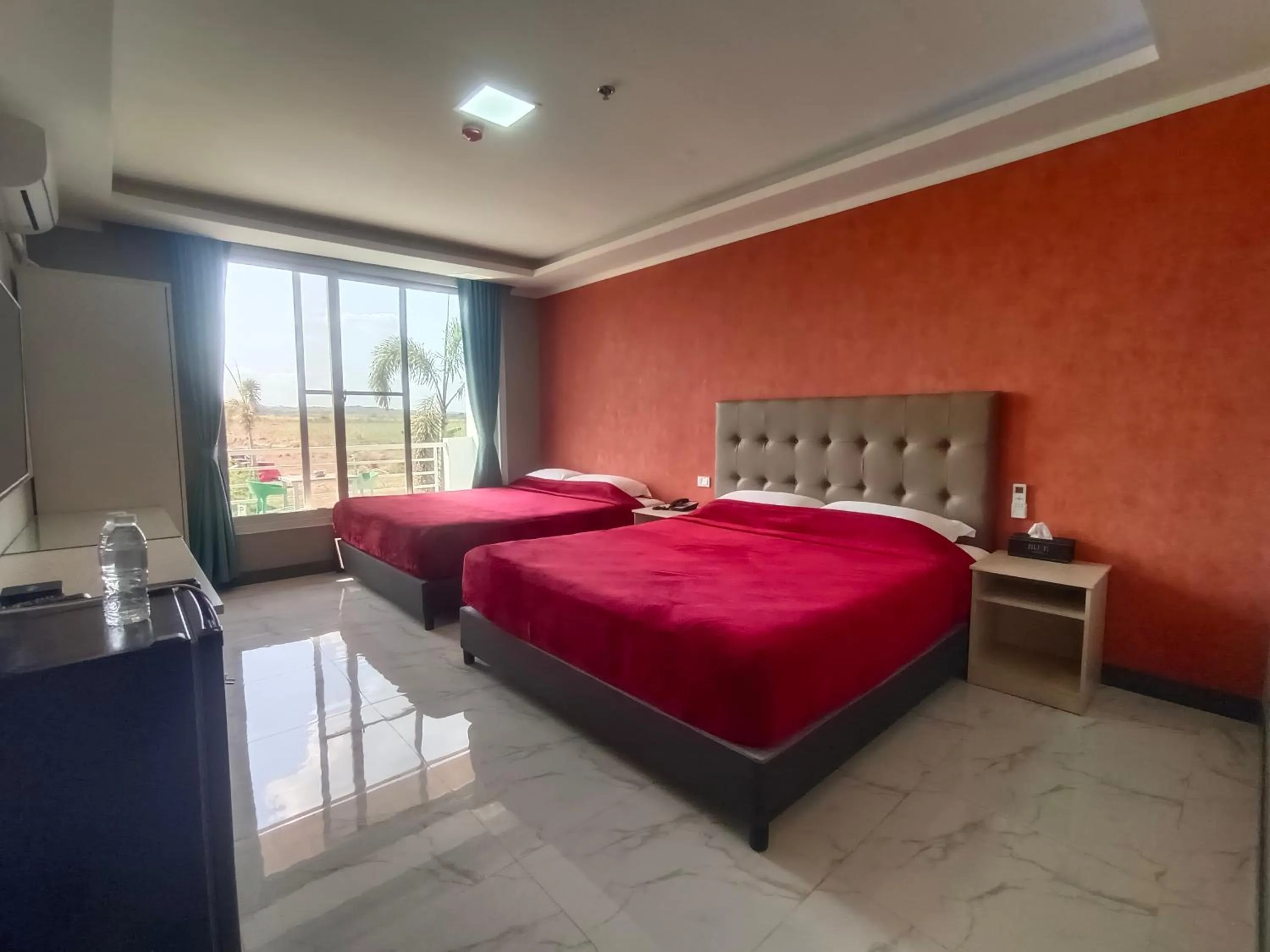 Bed in Blue Hotel and Resort