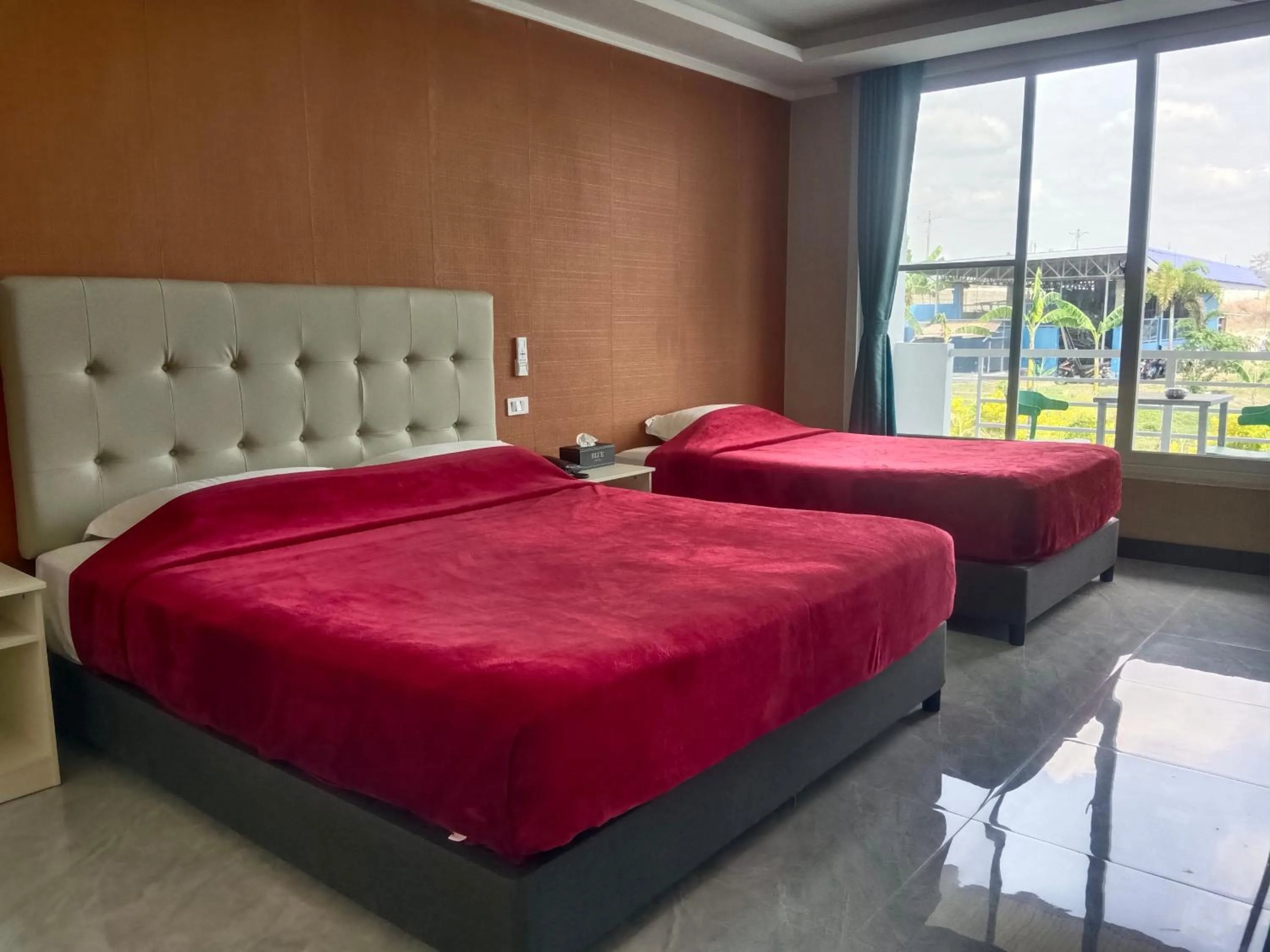 Bed in Blue Hotel and Resort