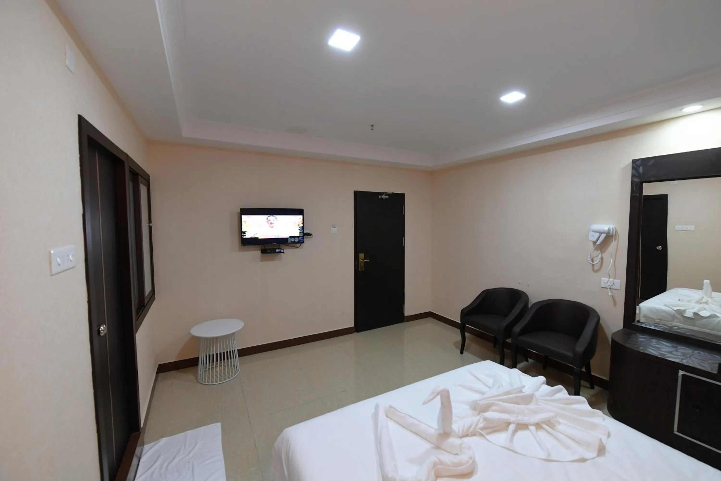 Bed in Coastal Grand Hotel Sampath