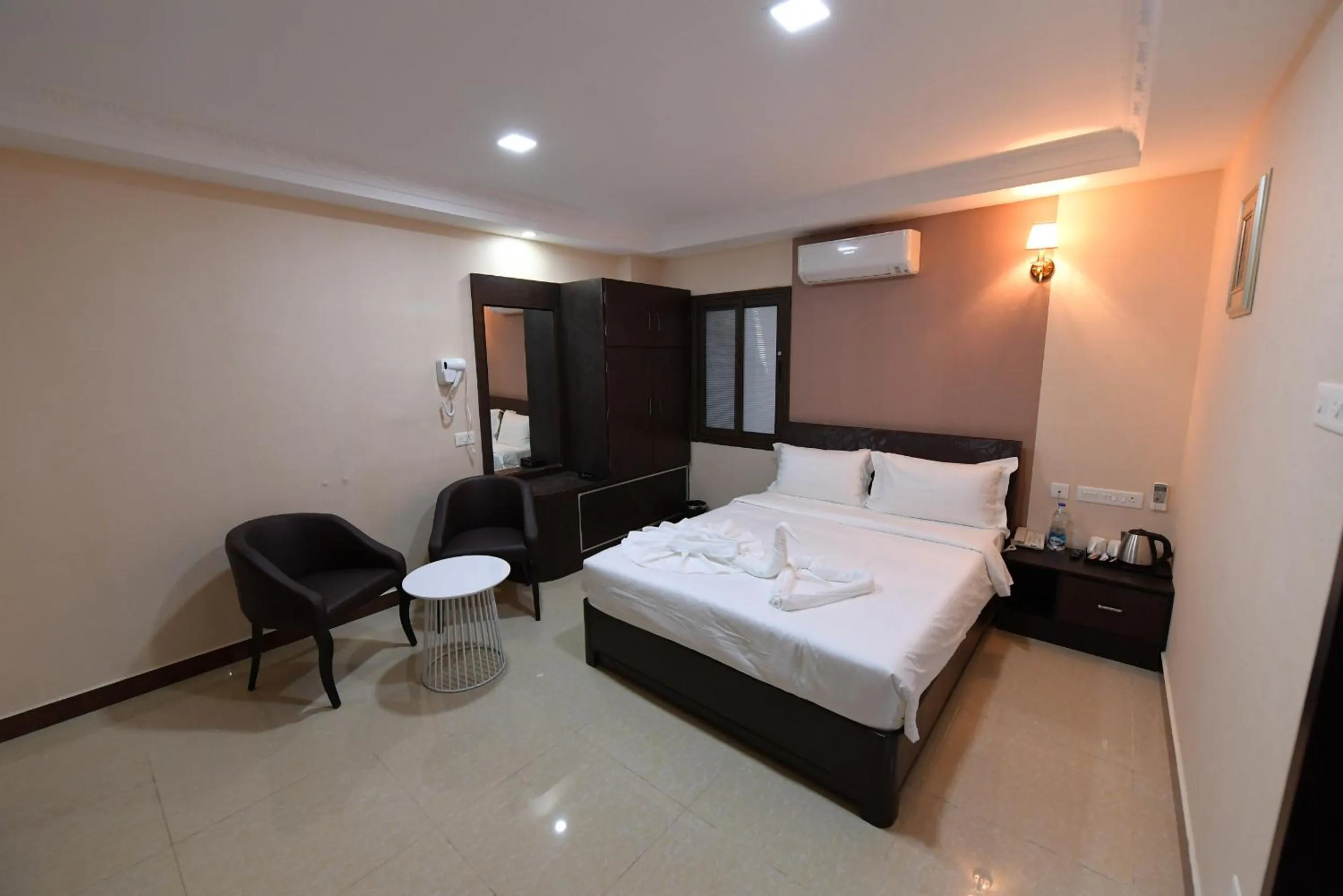 Bed in Coastal Grand Hotel Sampath