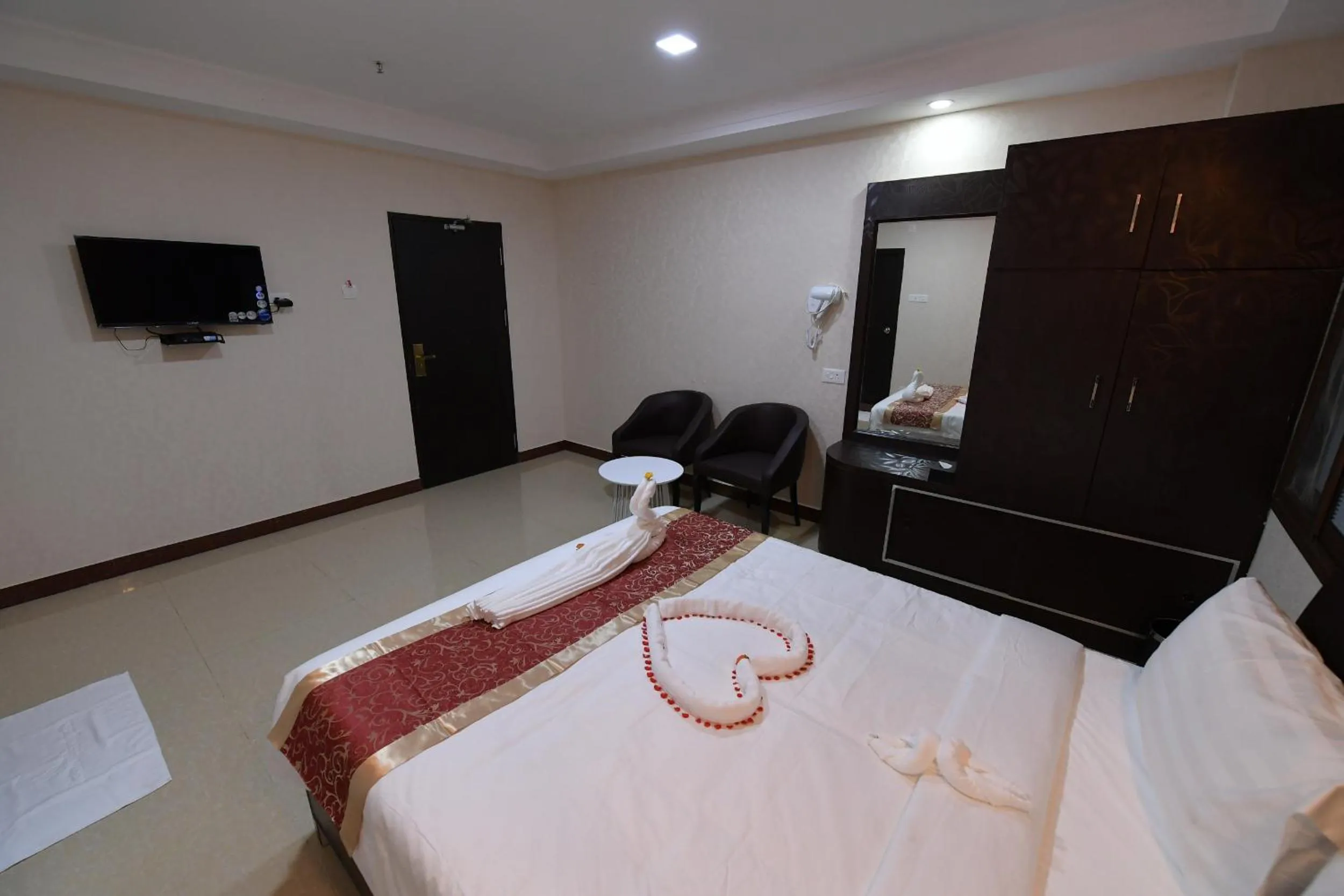 Bed in Coastal Grand Hotel Sampath