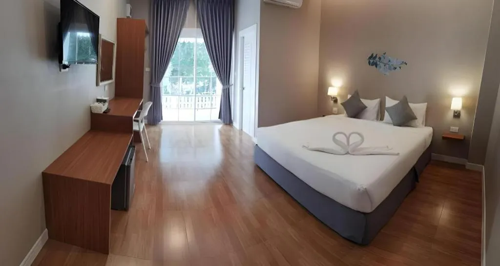 Bed in Thong Prachok Hotel