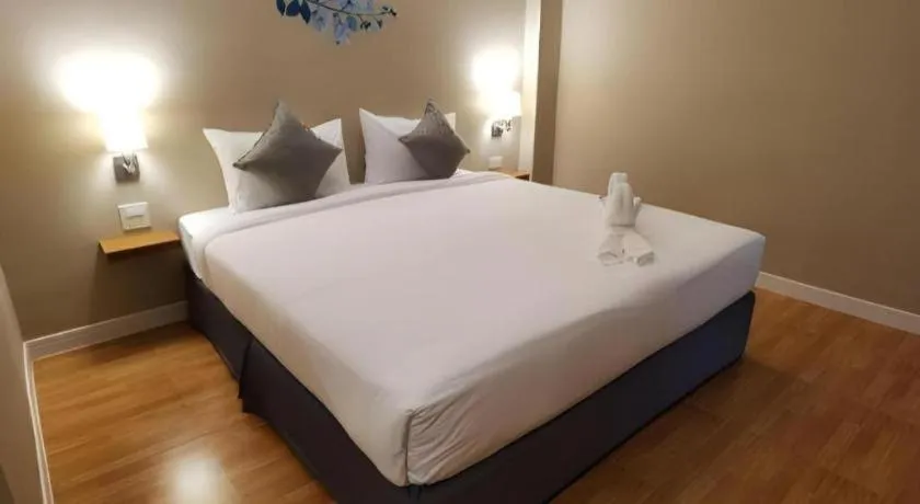 Bed in Thong Prachok Hotel