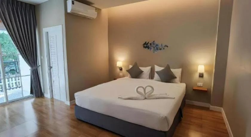 Bed in Thong Prachok Hotel