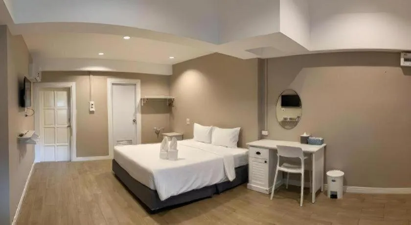 Bed in Thong Prachok Hotel