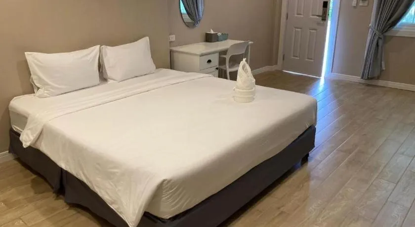 Bed in Thong Prachok Hotel