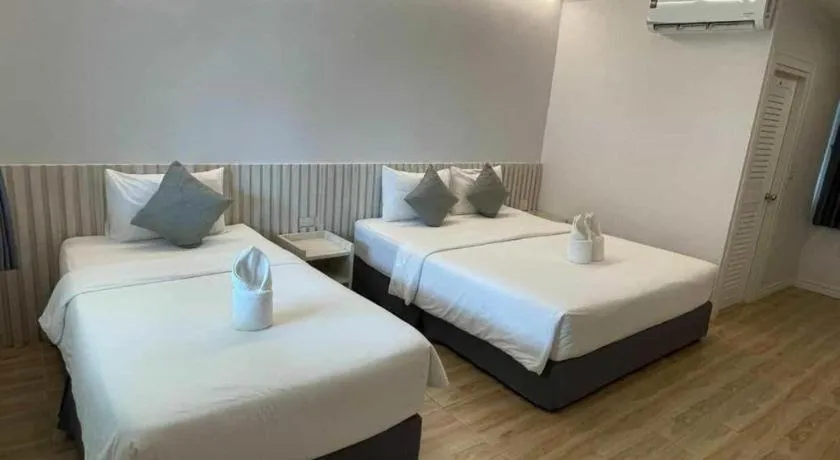 Bed in Thong Prachok Hotel