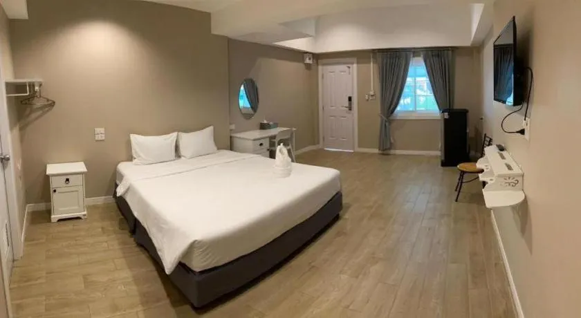 Bed in Thong Prachok Hotel