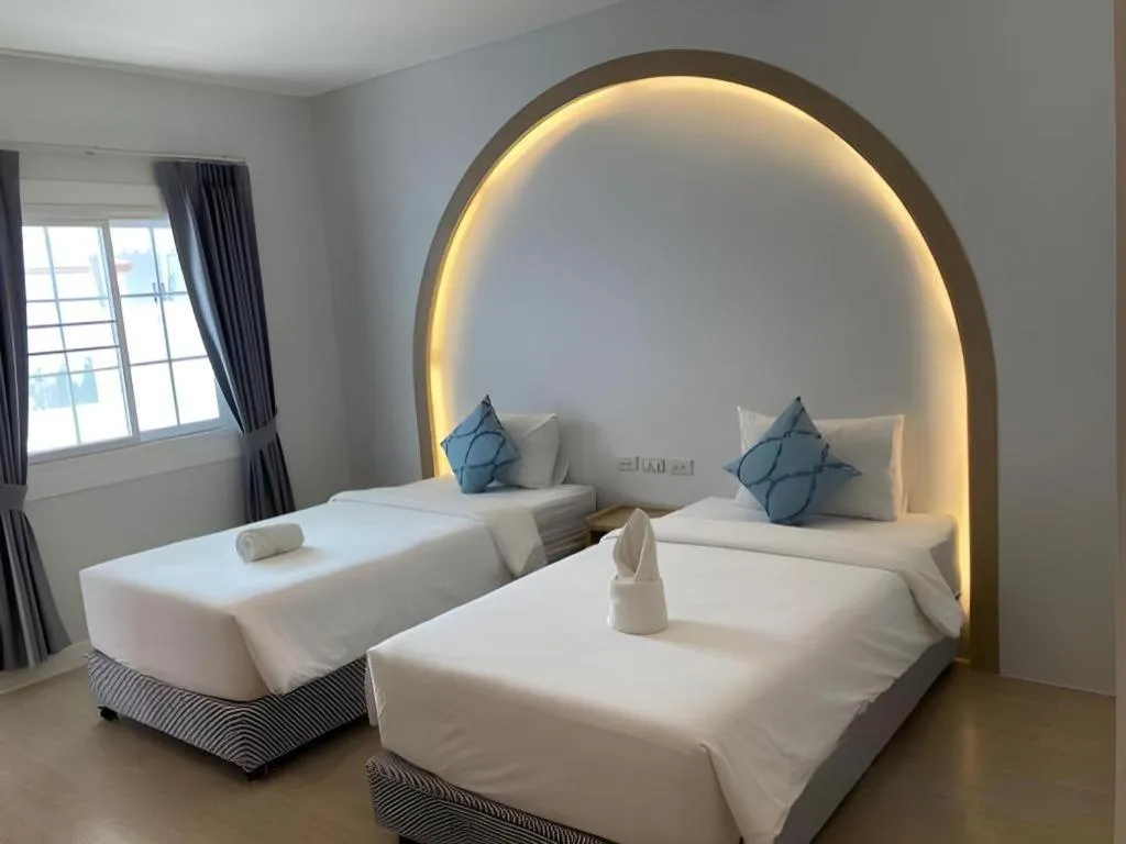 Bed in Thong Prachok Hotel