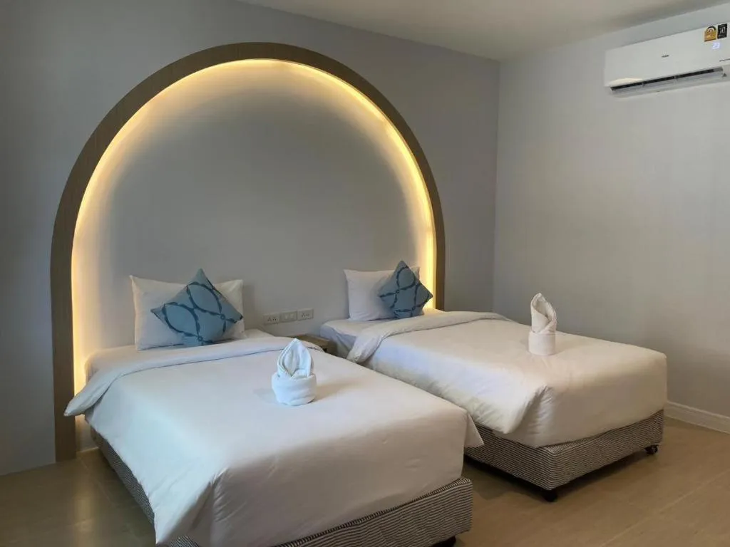 Bed in Thong Prachok Hotel