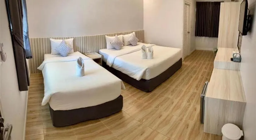 Bed in Thong Prachok Hotel