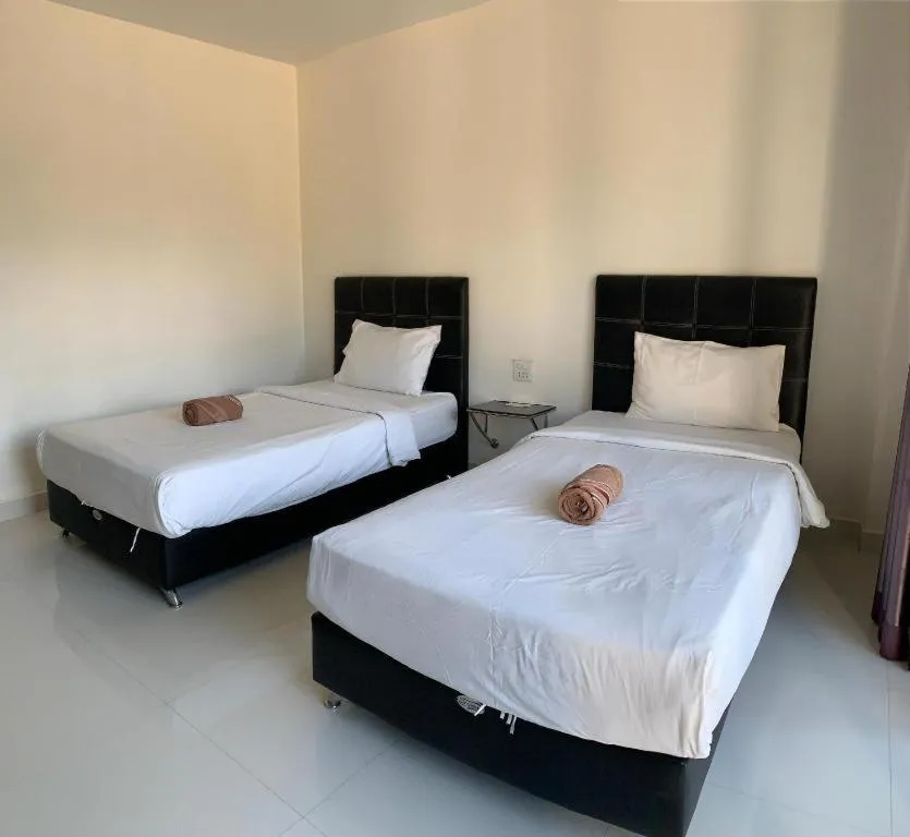 Bed in Niwtara Place Lom Sak Hotel