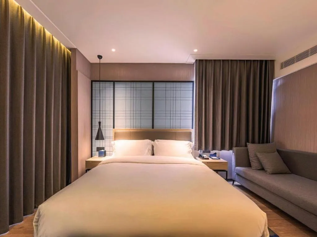 Bed in Echarm Hotel Hanzhong Wetland Park