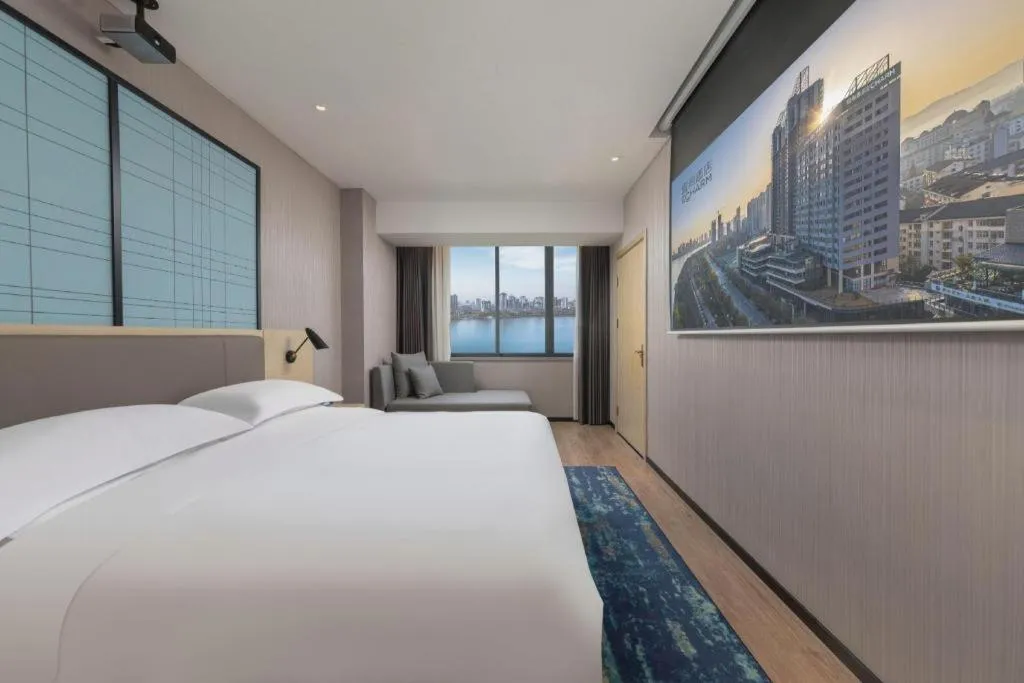 Bed in Echarm Hotel Hanzhong Wetland Park