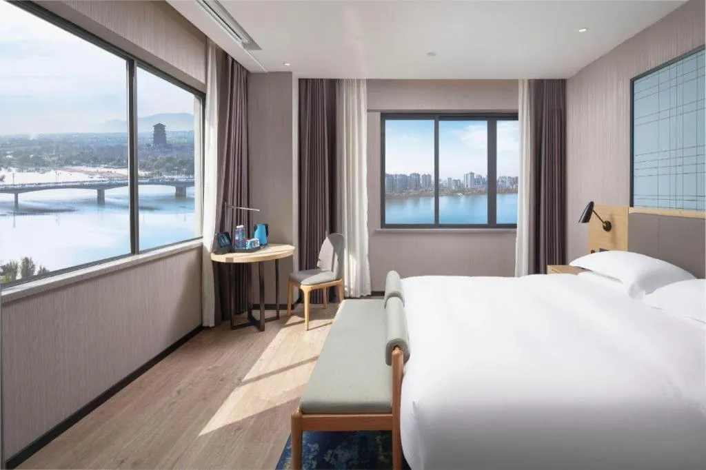 Bed in Echarm Hotel Hanzhong Wetland Park