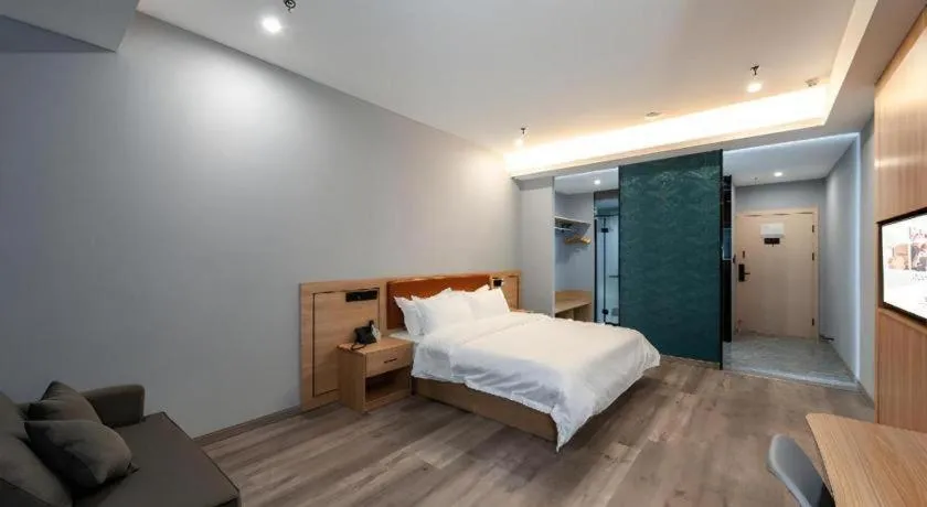 Bed in Borrman Hotel Jiangyin Zhouzhuang