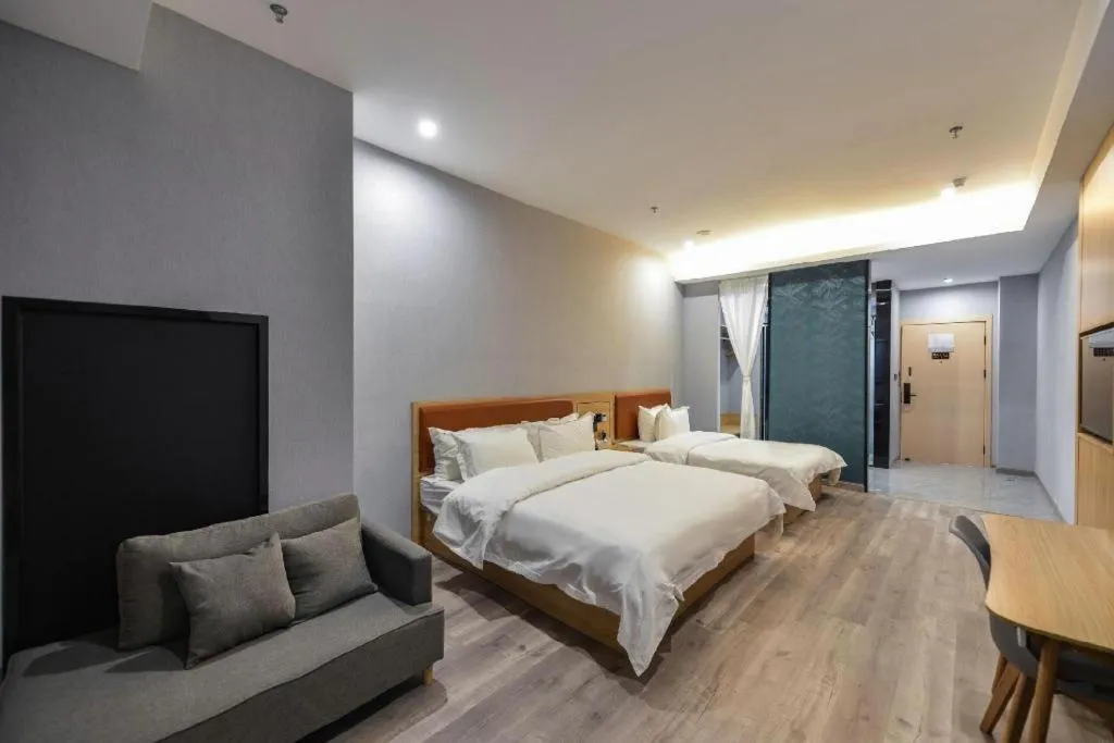 Bed in Borrman Hotel Jiangyin Zhouzhuang