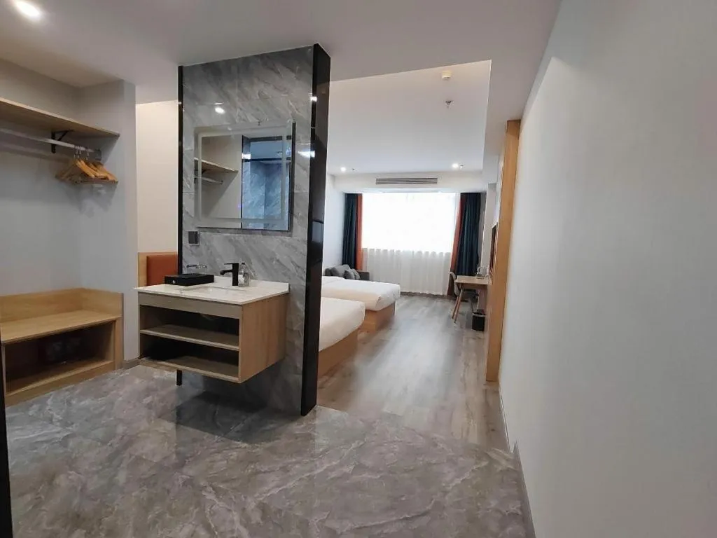 Bed in Borrman Hotel Jiangyin Zhouzhuang