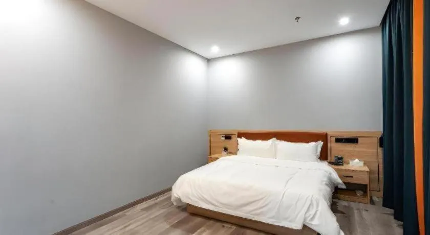 Bed in Borrman Hotel Jiangyin Zhouzhuang