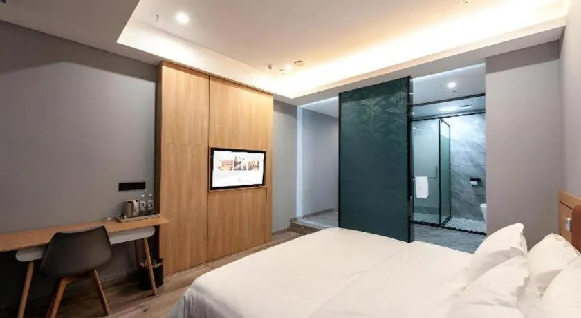 Bed in Borrman Hotel Jiangyin Zhouzhuang