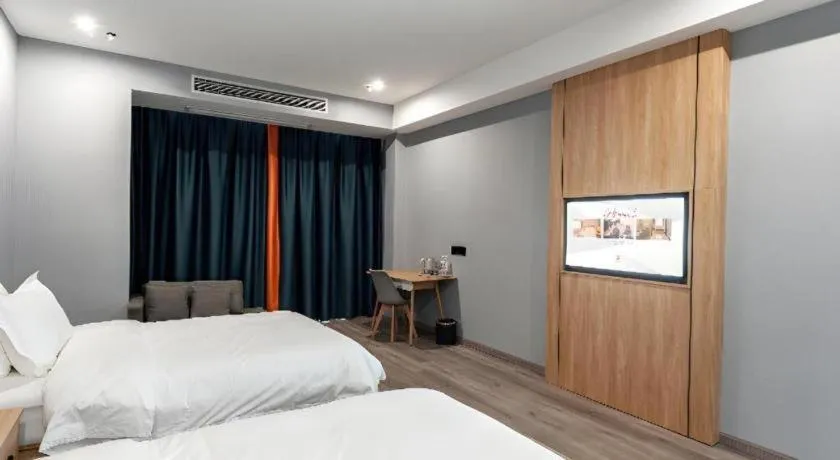 Bed in Borrman Hotel Jiangyin Zhouzhuang