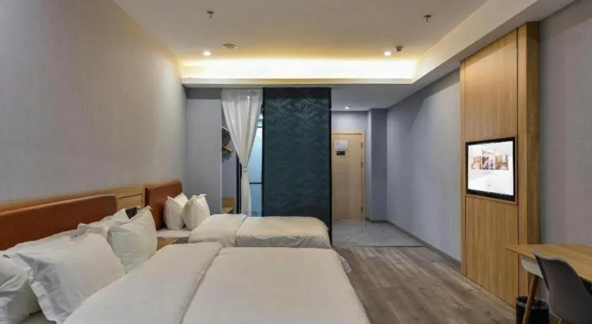 Bed in Borrman Hotel Jiangyin Zhouzhuang