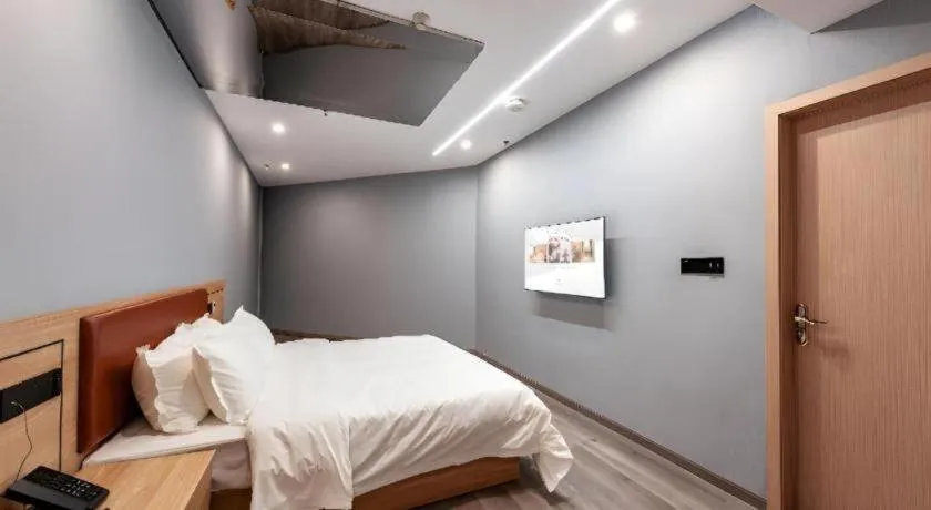 Bed in Borrman Hotel Jiangyin Zhouzhuang