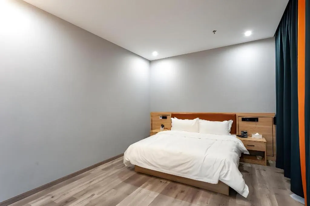 Bed in Borrman Hotel Jiangyin Zhouzhuang