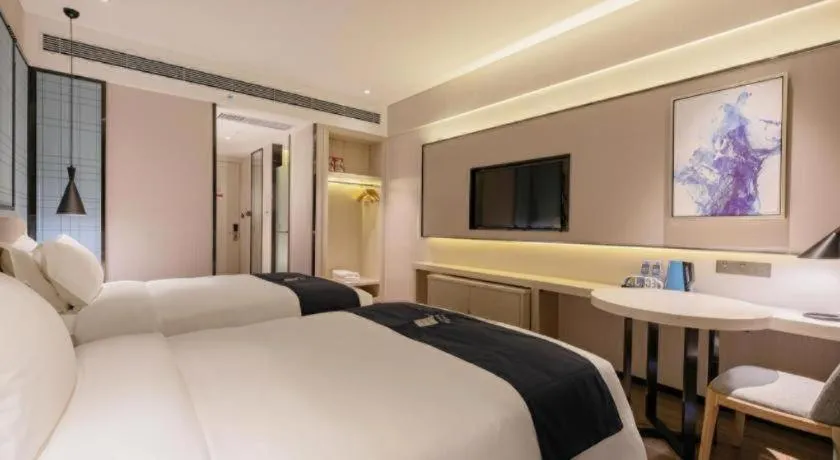 Bed in Echarm Hotel Yantai Wuzhou International