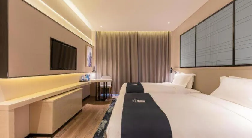 Bed in Echarm Hotel Yantai Wuzhou International