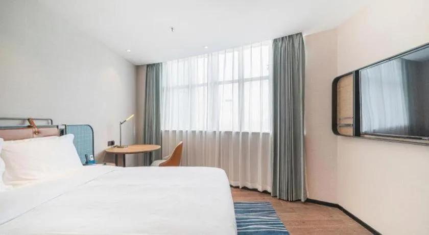 Bed in Echarm Hotel Nanjing Expo Center Olympic East Metro Station