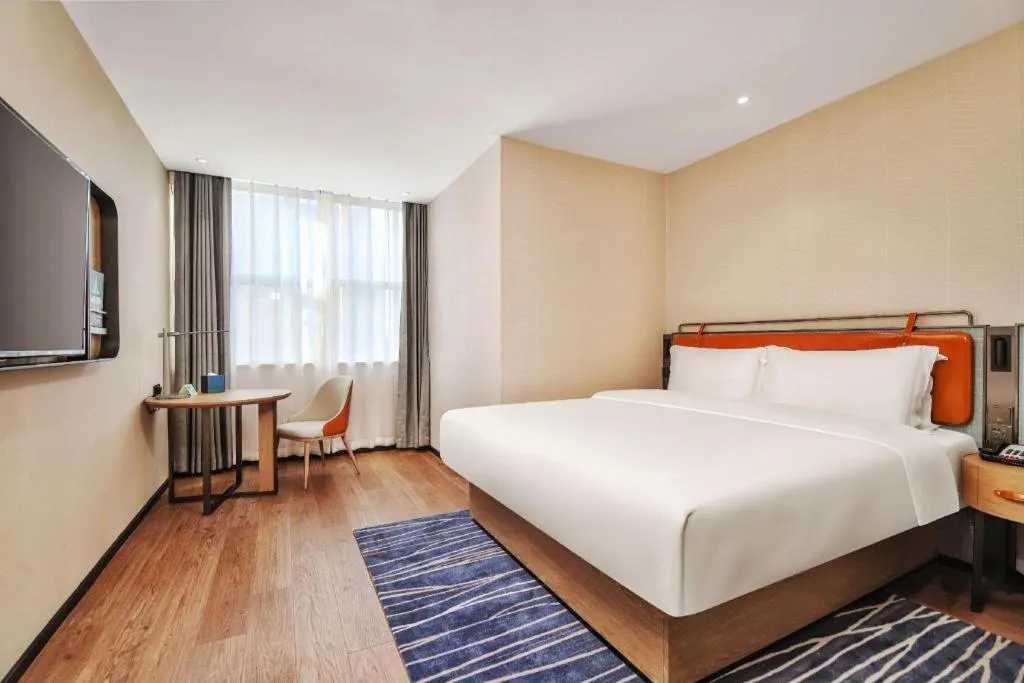 Bed in Echarm Hotel Nanjing Expo Center Olympic East Metro Station