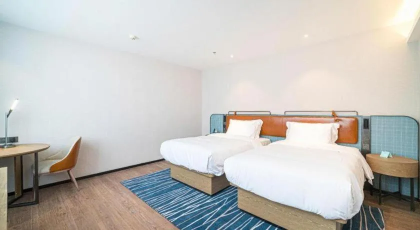 Bed in Echarm Hotel Nanjing Expo Center Olympic East Metro Station