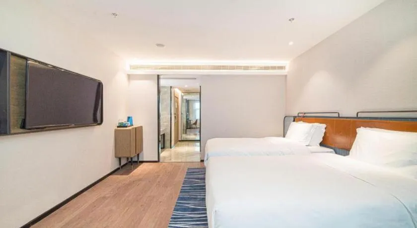 Bed in Echarm Hotel Nanjing Expo Center Olympic East Metro Station