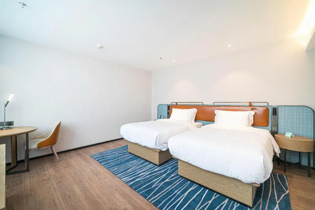 Bed in Echarm Hotel Nanjing Expo Center Olympic East Metro Station